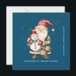 Cartes Pour Fêtes Annuelles Gnome et Snowman Bonnes Fêtes Business Flat<br><div class="desc">Un gnome habillé de rouge et de vert se dresse à côté d'un bonhomme de neige, dans un casquette d'elfes rouge et un foulard rouge. Ils sont entourés d'une poussière de neige blanche qui s'opère sur l'arrière - plan bleu foncé. L'esthétique minimaliste est réalisée avec une simple Bonnes Fêtes ci-dessous...</div>
