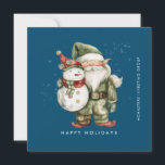 Cartes Pour Fêtes Annuelles Gnome et Snowman Happy Holidays Business Flat<br><div class="desc">Un gnome habillé de vert se dresse à côté d'un bonhomme de neige dans un casquette rouge et un foulard rouge. Ils sont entourés d'une poussière de neige blanche qui s'opère sur l'arrière - plan bleu foncé. L'esthétique minimaliste est réalisée avec un simple Happy Holidays en bas et le nom...</div>