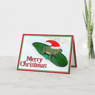 Cartes Pour Fêtes Annuelles Grenouille de Noël dévalant la neige sur un nénuph