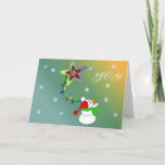 Cartes Pour Fêtes Annuelles Joyeux Snowman<br><div class="desc">Un bonhomme de neige géant balançant sur une chaîne colorée de lumières d'une étoile. Des flocons de neige dans l'arrière - plan.</div>