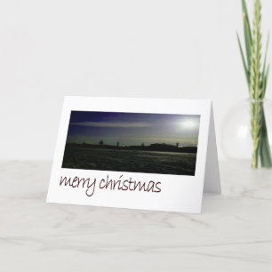Cartes Pour Fêtes Annuelles La silhouette de la ville sur le littoral gelé