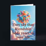Cartes Pour Fêtes Annuelles Obligations sans âge<br><div class="desc">Découvrez le charme chaleureux de notre Carte de voeux d'amitié "Ageless Bonds". L'extérieur est orné d'une magnifique image de ballons colorés flottant dans les nuages, symbolisant la nature édifiante de l'amitié, accompagnée du message réfléchi : "Ils disent que l'amitié ajoute des années à votre vie." A l'intérieur, une illustration touchante...</div>