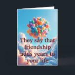 Cartes Pour Fêtes Annuelles Obligations sans âge<br><div class="desc">Découvrez le charme chaleureux de notre Carte de voeux d'amitié "Ageless Bonds". L'extérieur est orné d'une magnifique image de ballons colorés flottant dans les nuages, symbolisant la nature édifiante de l'amitié, accompagnée du message réfléchi : "Ils disent que l'amitié ajoute des années à votre vie." A l'intérieur, une illustration touchante...</div>