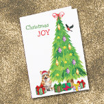 Cartes Pour Fêtes Annuelles Pembroke Welsh Corgi Chien, Oiseau et Arbre de Noë<br><div class="desc">Sur le devant de cette carte de Noël, un adorable petit chien de Pembroke Welsh Corgi porte un casquette du Père Noël rouge et blanc assis à côté d'un arbre de Noël. Des emballages de cadeaux aux couleurs vives sont éparpillés, et un bullfinch débarque sur le sapin de Noël. Le...</div>