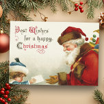 Cartes Pour Fêtes Annuelles Père Noël vintage et enfant avec lettre de Noël<br><div class="desc">Image nostalgique du Père Noël de l'ère victorienne à robes rouges portant sac de jouets recevant une lettre d'un enfant timide en manteau bleu et casquette. Image complémentaire à l'envers avec du texte personnalisable.</div>