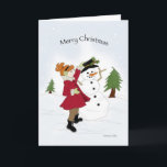 Cartes Pour Fêtes Annuelles Snowman et petite fille<br><div class="desc">Petite fille en manteau rouge habillant un bonhomme de neige dans la neige</div>
