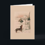 Cartes Pour Fêtes Annuelles Vintage - Snowman salue un Dachshund,<br><div class="desc">Illustration vintage d'un bonhomme de neige en train de se bouger la tête en saluant un chien Dachshund qui l'a approché lors d'un jour d'hiver enneigé.  Cette carte est vide à l'intérieur pour votre propre message.</div>