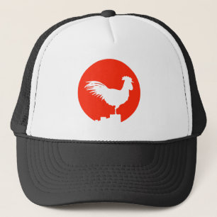 Casquette Coq sur une barrière