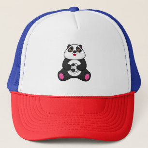 Casquette Panda comme joueur de football avec balle de footb