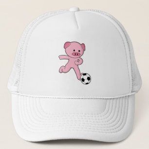 Casquette Pig comme joueur de football avec balle de footbal