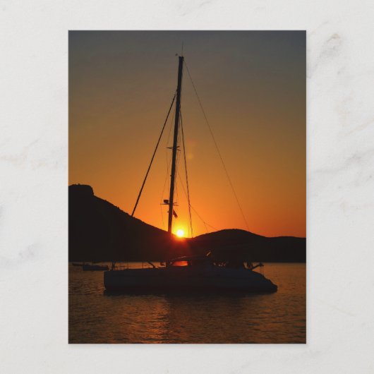 Catamaran op zonsondergang Ibiza. Briefkaart (Voorkant)