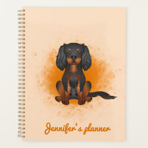 Cavalier King Charles noir et fauve sur fond orang