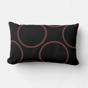 cercles marron sur un oreiller moderne noir