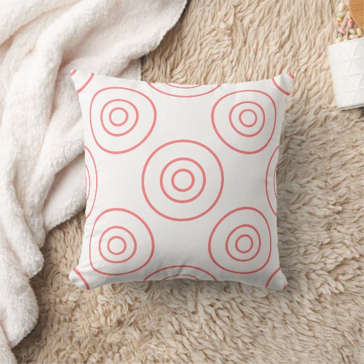 Cercles roses sur un coussin blanc (Couverture)