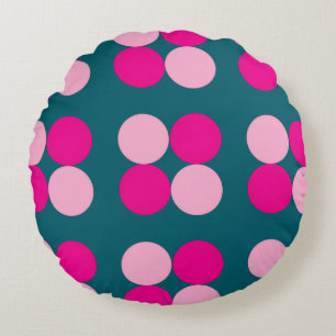 Cercles roses sur un coussin rond vert