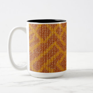 C'est une tasse motif broderie.