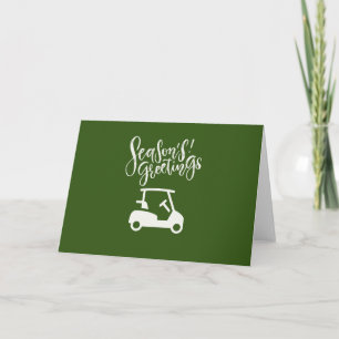 Chariot de golf avec carte de vœux de Noël      