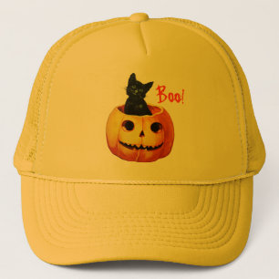 Chat dans le casquette de Halloween de citrouille