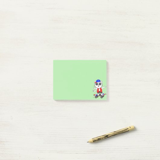 Chat de patinage sur Lime Green Post-it Notes (Sur un bureau)