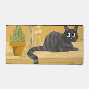 Chat drôle sur le bureau avec Plantes