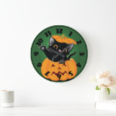 Chat noir dans une horloge de citrouille (Maison)
