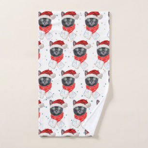 Chat noir de Noël avec écharpe rouge