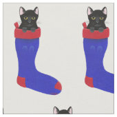 Chat noir décoratif dans le tissu de bas de Noël (Fermer)