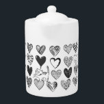 Chat noir et blanc et Motif de coeur<br><div class="desc">Chatte jouant tendu sur un ballon en forme de coeur entouré de différents coeurs à motifs en noir et blanc.</div>