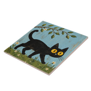 Chat noir joueur sur carreau en céramique bleu