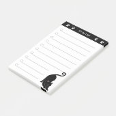 Chat noir mignon sur notes post-it noir et blanc (Incliné)