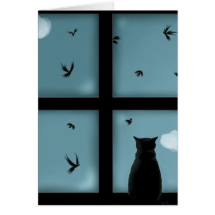 Chat noir regardant la fenêtre le ciel