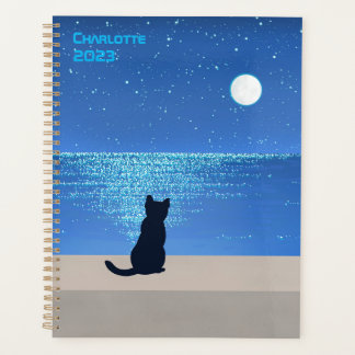 Chat noir sous la nuit étoilée pleine lune