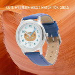 Chat Occidental Et Nom Turquoise<br><div class="desc">Cette jolie montre à poignet conçue par un chat occidental est pour les enfants. Le design a été inspiré par les vieux tapis tissés du Rio Grande d'Amérique autochtone. Les couleurs de la terre comprennent l'ocre, le marron, le turquoise et l'argile rouge. Ces yeux turquoises s'écorchent d'un visage de montre...</div>