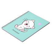 Chaton mignon génial sur un cahier sarcelle clair (Côté gauche)