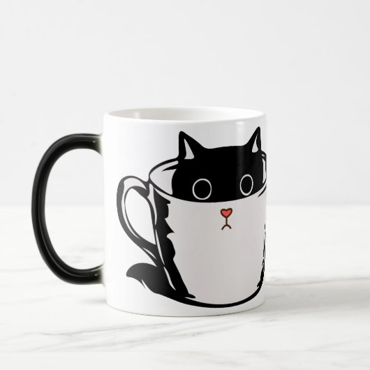 Chaton noir avec nez rouge caché dans une tasse (Gauche)