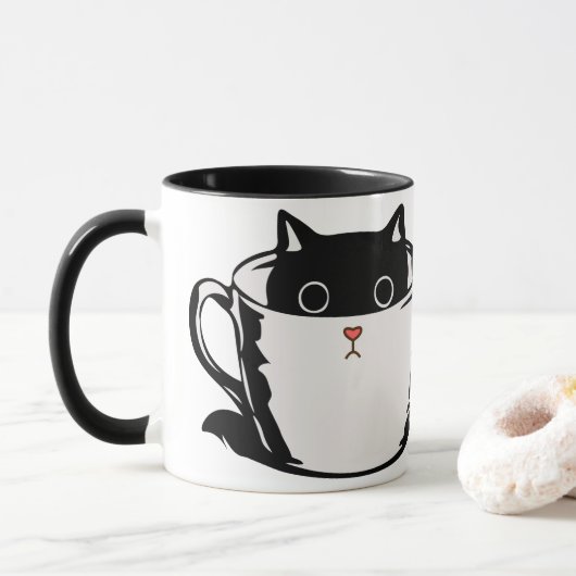 Chaton noir avec nez rouge caché dans une tasse (Avec donut)
