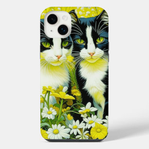 Chats adorables assis dans un champ de marguerites