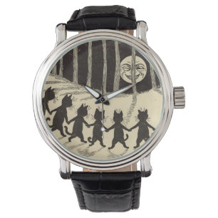 Chats dansant dans la montre de clair de lune