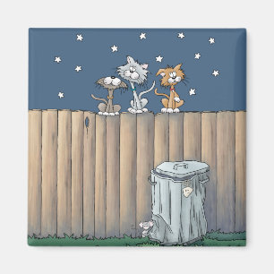 Chats de ruelle sur un aimant de clôture