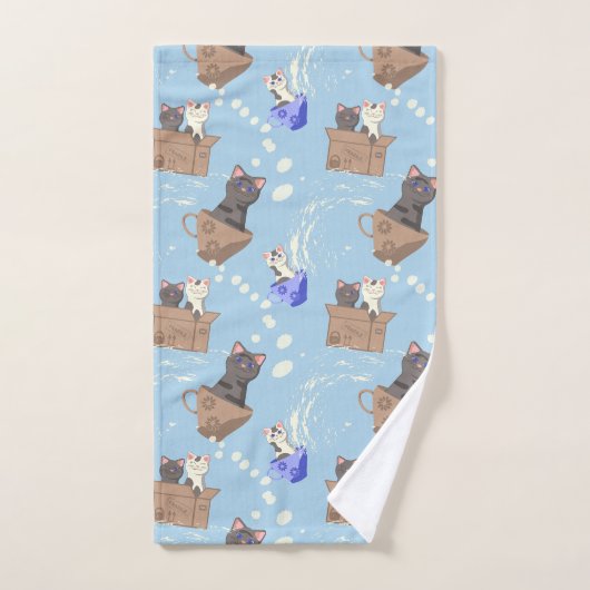Chats en boîte et gouttes de lait sur bleu (Serviette à main)