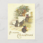 Chats vintages sur la carte postale de Joyeux Noël<br><div class="desc">Belle carte postale vintage de Noël montrant 4 sur des escaliers regardant un arbre de Noël bien décoré.</div>