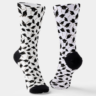 Chaussette Casquettes de graduation noir jetées en l'air sur