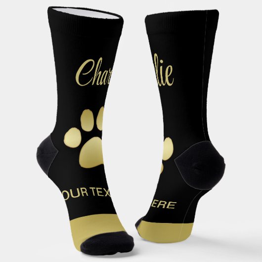 Chaussette Paw chien brillant or sur arrière - plan noir (Angulaire)