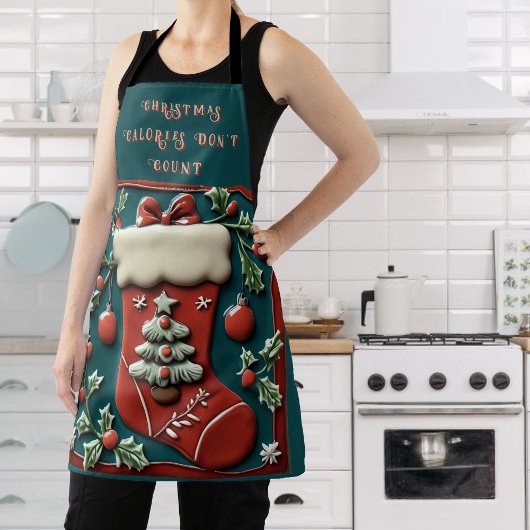 Chaussette rouge sur tablier de Noël vert