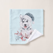 Chien de Noël Husky dans un chapeau de Père Noël (Gant de toilette)
