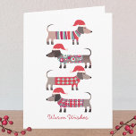 Chiens de Dachshund à Noël Chapeaux<br><div class="desc">Adorable petits chiens de Noël Dachshund Wiener ou Saucage dans des vêtements douillets en hiver et chapeaux de Père Noël. Customisez en changeant les salutations à l'avant et à l'intérieur,  et changez ou supprimez les noms.</div>