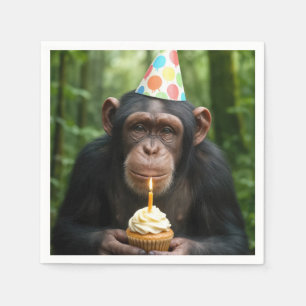 Chimpansee houdt verjaardagscupcake vast servet