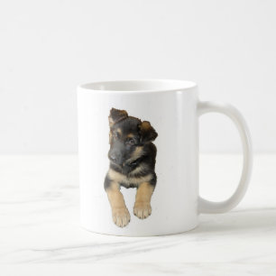 Chiot de berger allemand et dire sur une tasse