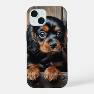 Chiot noir et tan Cavalier