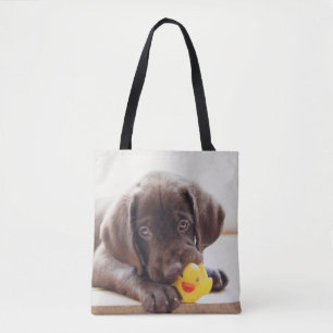 Chocolade Labrador Puppy met Speelgoed Duck Draagtas
